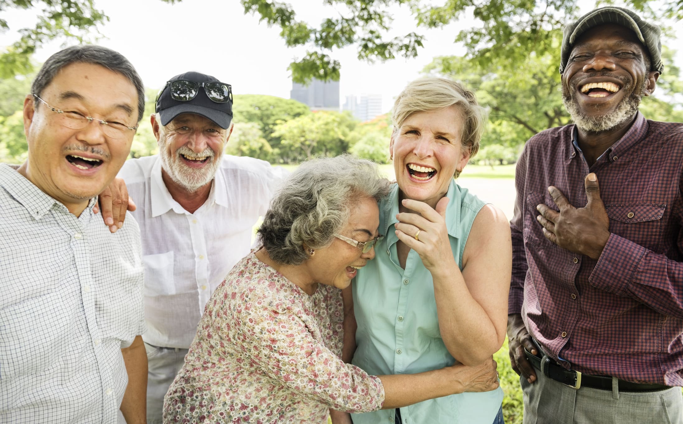 Happy solo aging seniors outside together