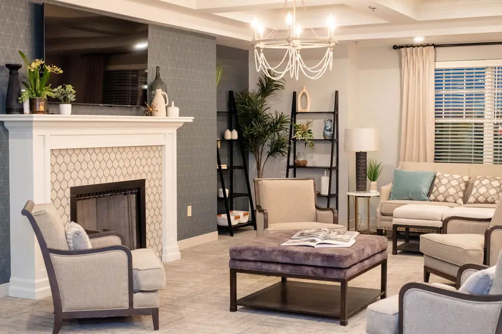 Comfortable common living room with a fireplace and lounge seating