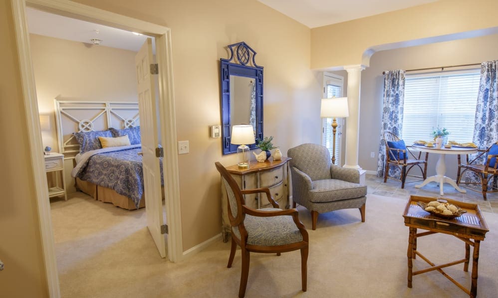 Apartment living area with an open doorway to the bedroom