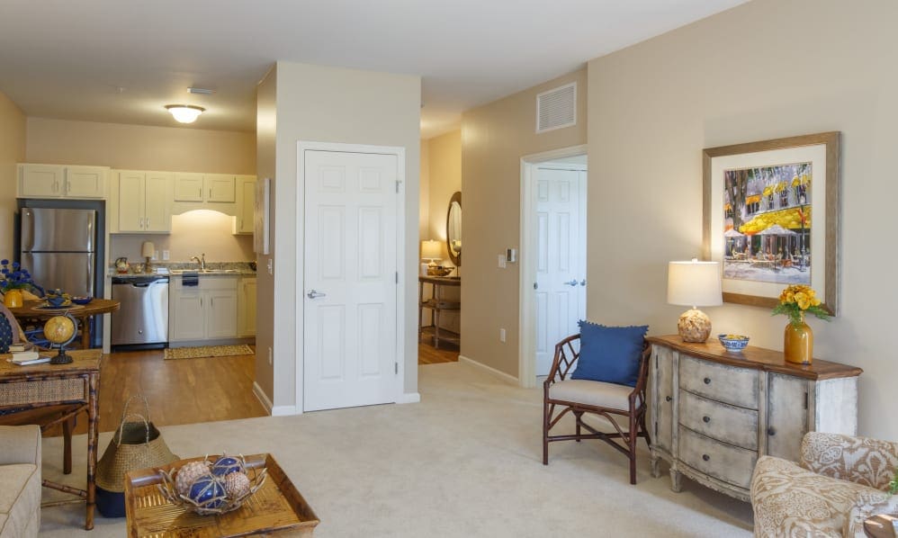Apartment with a full kitchen, sitting area and bedroom entry